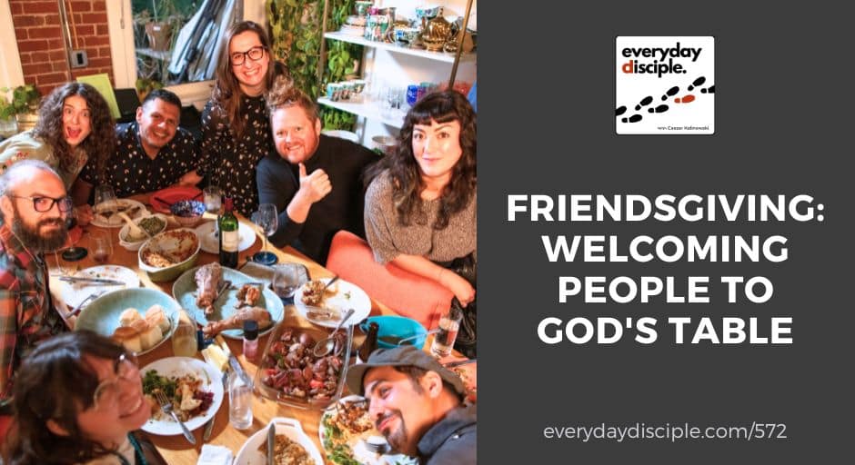 A group of friends laughing, gathered around a table celebrating thanksgiving as a family.